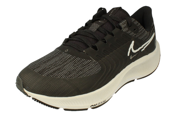 A front, left angle of the Nike Air Zoom Pegasus 38 Shields in a black platinum tint. This angle showcases the strong flynit material used to provide warmth. 