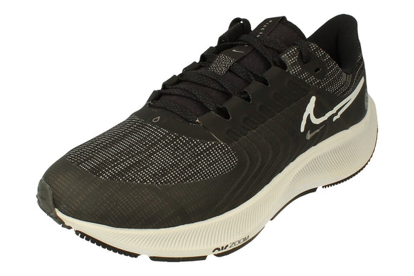 A front, left angle of the Nike Air Zoom Pegasus 38 Shields in a black platinum tint. This angle showcases the strong flynit material used to provide warmth. 
