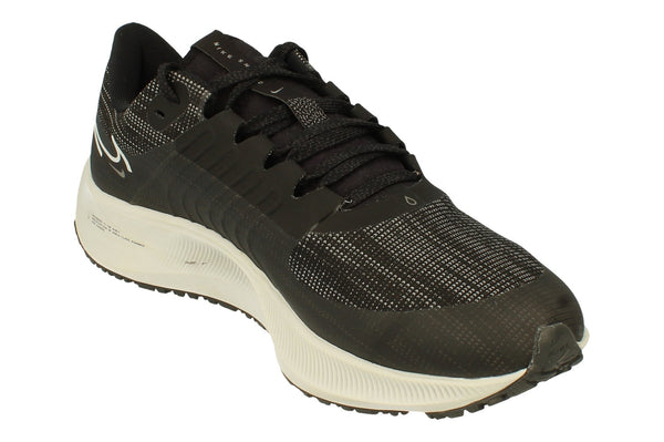 A front, left angle of the Nike Air Zoom Pegasus 38 Shields in a black platinum tint. This angle showcases the strong flynit material used to provide warmth. 