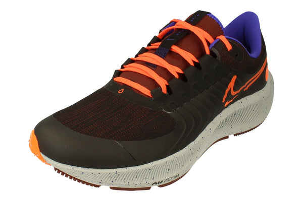 A front left angle of the Nike Air Zoom Pegasus 38 Shield highlighting the upper water-resistant material. 