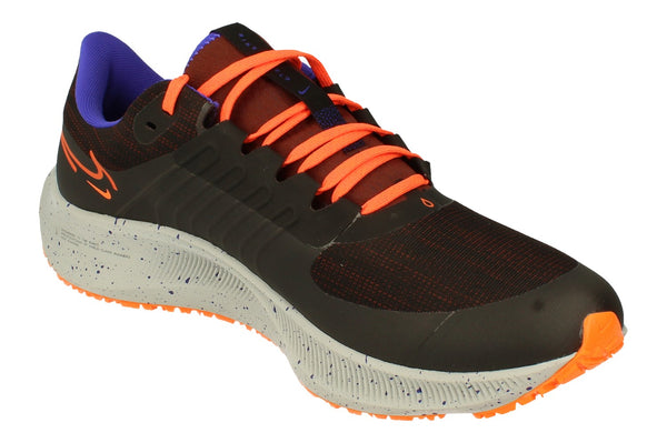 A front left angle of the Nike Air Zoom Pegasus 38 Shield highlighting the upper water-resistant material. 
